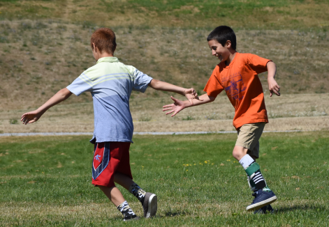 This image show kids playing wearing Cascade DAFO braces. 